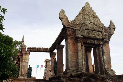 <p>Cambodian police officials are seen standing outside the Preah Vihear temple, on July 18, 2012. Thailand and Cambodia are to face off at the UN's highest court on Monday in a dispute over land surrounding the temple that has seen deadly clashes along their joint border.</p>
