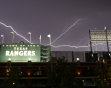 Lightning crawls across the sky over the Texas Rangers Ballpark in Arlington during a severe thunderstorm following  an interleague baseball game between the Houston Astros and Texas Rangers, Tuesday,