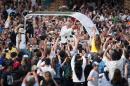 People wave as Pope Francis drives along Independence Mall on his way to Independence Hall on September 26, 2015 in Philadelphia, Pennsylvania
