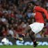 Manchester United's Diouf shoots during Paul Scholes' testimonial soccer match against New York Cosmos in Manchester