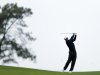 Tiger Woods hits his second shot on the 14th fairway of the north course at Torrey Pines Golf Course during the second round of the Farmers Insurance Open golf tournament Friday, Jan. 25, 2013, in San Diego. (AP Photo/Gregory Bull)