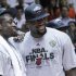 Miami Heat's Dwyane Wade, left, and LeBron James stand together during the trophy presentation following the Heat's 101-88 victory over the Boston Celtics in Game 7 in the NBA basketball Eastern Conference Finals playoff series, Saturday, June 9, 2012, in Miami. (AP Photo/Lynne Sladky)