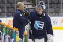 Europe head coach Ralph Krueger, left, talks to goaltender Jaroslav Halak during practice at the World Cup of Hockey in Toronto on Friday, Sept. 23, 2016. (Chris Young/The Canadian Press via AP)