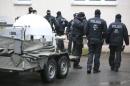 German special policemen search a housing area in the eastern city of Chemnitz on suspicion that a bomb attack was being planned