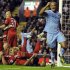 Manchester City's Kompany celebrates scoring against Liverpool during their English Premier League soccer match in Liverpool