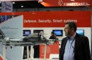 A visitor walks past a stand for Italian defence group Finmeccanica during the IDEX at the Abu Dhabi National Exhibition Centre