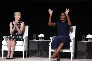 Actress Charlize Theron, left, applauds first lady&nbsp;&hellip;