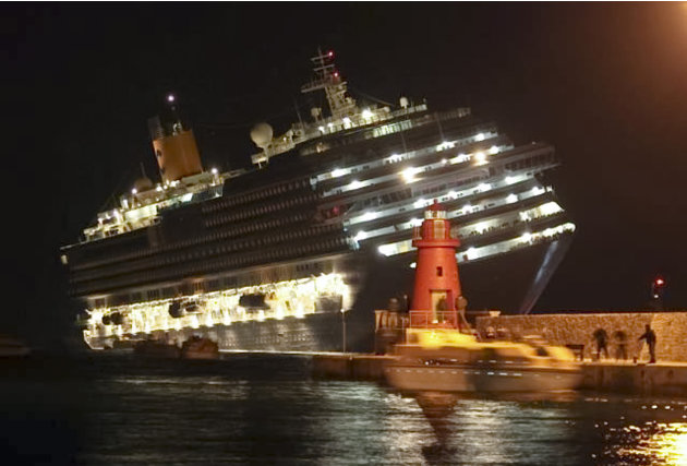 The luxury cruise ship Costa Concordia leans after it ran aground off the coast of Isola del Giglio island, Italy, gashing open the hull and forcing some 4,200 people aboard to evacuate aboard lifeboa
