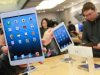 People try out the new iPad minis at Apple Store Ginza in Tokyo