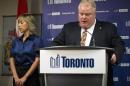 Toronto Mayor Ford speaks at a news conference with his wife Renata at City Hall in Toronto