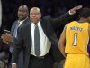 Los Angeles Lakers interim head coach Bernie Bickerstaff, center, pats guard Darius Morris on the head as assistant coach Chuck Person looks on during the first half of their NBA basketball game against the Golden State Warriors, Friday, Nov. 9, 2012, in Los Angeles. (AP Photo/Mark J. Terrill)