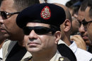 Egypt's Defense Minister Gen. Abdel-Fattah el-Sissi attends the funeral of Giza Police Gen. Nabil Farrag in Cairo, Egypt, Friday, Sept. 20, 2013. Farrag was killed after unidentified militants opened fire on security forces deployed Thursday to the town of Kerdasa to drive off suspected Islamists taking control of the town near Giza Pyramids. (AP Photo/Hassan Ammar)