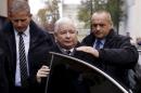 File picture shows leader of Poland's main opposition Law and Justice party Jaroslaw Kaczynski arriving with his security guards before meeting with citizens of Brzeziny city near Lodz, central Poland