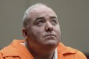 FILE - In this Jan. 24, 2012 file photo, Michael Skakel looks up while listening to a statement from John Moxley, brother of victim Martha Moxley in court in Middletown, Conn. Skakel's first parole hearing is scheduled for Wednesday, Oct. 24, 2012, at McDougall-Walker Correctional Institution in Suffield. Officials say Skakel is eligible to be released next spring if parole officials approve it. He is serving 20 years to life for fatally beating Martha Moxley with a golf club in Greenwich when they were 15-year-old neighbors. (AP Photo/Jessica Hill, Pool, File)