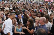 U.S. President Barack Obama poses with crowd members after speaking at a campaign event at Natural Habitat Park Field on the St. Petersburg College Seminole Campus in Florida September 8, 2012. REUTERS/Larry Downing