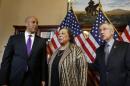 U.S. Senator-elect Booker, and his mother, Carolyn Booker, stand with U.S. Senate Majority Leader Reid before Booker is sworn in later this morning on Capitol Hill in Washington