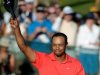 Tiger Woods waves his hat to the crowd after winning the Arnold Palmer Invitational golf tournament at Bay Hill in Orlando, Fla., Sunday, March 25, 2012. (AP Photo/Phelan M. Ebenhack)