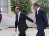 France’s President Francois Hollande, left,  welcomes Greece's Prime Minister Antonis Samaras at the Elysee Palace, Saturday, Aug. 25, 2012. As the country's Prime Minister, Antonis Samaras, heads around Europe for top-level talks on Greece's attempts to right its finances, austerity-weary Greeks back home are preparing themselves for new pain amid fears that they may be kicked out of the 17-country group that uses the euro. (AP Photo/Michel Euler)