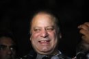 Incoming Pakistani PM Sharif talks to journalists after visiting politician Khan in Lahore