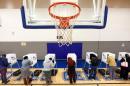Citizens vote on a basketball court at a recreation center serving as polling place during the U.S. general election in Greenville, North Carolina