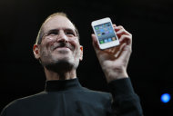 FILE - In this June 7, 2010, file photo, Apple CEO Steve Jobs holds a new iPhone at the Apple Worldwide Developers Conference in San Francisco. Apple on Wednesday, Oct. 5, 2011 said Jobs has died. He was 56. (AP Photo/Paul Sakuma, File)