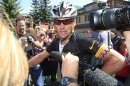 FILE - In this Aug. 25, 2012 file photo, Lance Armstrong talks to reporters after his second-place finish in the Power of Four mountain bicycle race at the base of Aspen Mountain in Aspen, Colo. Nike Inc. is cutting ties with the Livestrong cancer charity founded by Armstrong. The move by the sports company is the latest fallout in the doping scandal surrounding the former cyclist, who now admits he used performance-enhancing drugs to win the Tour de France seven times. (AP Photo/David Zalubowski, FIle)