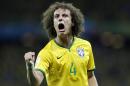 Brazil's David Luiz celebrates after scoring his side's second goal on a free kick during the World Cup quarterfinal soccer match between Brazil and Colombia at the Arena Castelao in Fortaleza, Brazil, Friday, July 4, 2014. (AP Photo/Natacha Pisarenko)