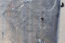 Climber Jorgeson climbs Pitch 18 of the Dawn Wall as a cameraman records on the El Capitan rock formation in Yosemite National Park