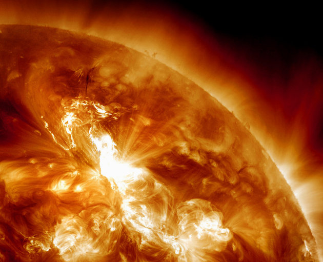 This handout image provided by NASA, taken Sunday night, Jan. 22, 2012, shows a  solar flare erupting on the Sun's northeastern hemisphere. Space weather officials say the strongest solar storm in mor