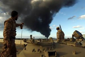 Members of the Libyan army stand on a tank as heavy&nbsp;&hellip;