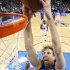 Dallas Mavericks forward Dirk Nowitzki (41), of Germany, dunks in front of Oklahoma City Thunder forward Kevin Durant (35) in the second quarter of an NBA basketball game in Oklahoma City, Monday, March 5, 2012. (AP Photo/Sue Ogrocki)
