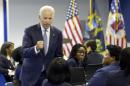 Vice President Joe Biden meets with students who participate in Step IT Up, an accelerated learning program which trains workers for high-growth and well paying information technology (IT) jobs in Detroit, Thursday, July 17, 2014. (AP Photo/Carlos Osorio)