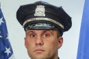This undated photo released by the Boston Police Department's official Twitter account Saturday, March 28, 2015, shows Officer John Moynihan, 34, who was shot in the face during a traffic stop Friday night that ended when other officers fatally shot his attacker. Moynihan was struck just below his right eye and was listed in critical condition Saturday as the bullet remained lodged below his right ear. A decorated veteran, Moynihan served in Iraq in 2006-2007 and was honored at the White House in May 2014 for being one of the first responders in Watertown, Mass., following the April 2013 gun battle with the Boston Marathon bombers. (AP Photo/Boston Police Department)