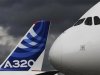 File photograph shows the nose cone of an Airbus A380 next to the tail fin of an Airbus A320 at the Farnborough Airshow 2012 in southern England