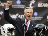 Tommy Tuberville pumps his fist as he was introduced as the new head football coach at the University of Cincinnati, Saturday, Dec. 8, 2012, in Cincinnati. Tuberville had been head coach at Texas Tech, and previously at Auburn and Mississippi. (AP Photo/Al Behrman)