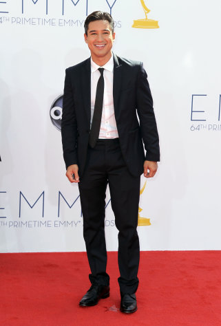 FILE - In this Sept. 23, 2012 file photo, Mario Lopez arrives at the 64th Primetime Emmy Awards at the Nokia Theatre, in Los Angeles. Fox’s “The X Factor” began airing live episodes Wednesday, Oct. 31, 2012, with new co-hosts Khloe Kardashian and Mario Lopez. (Photo by Matt Sayles/Invision/AP, File)