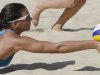 Italy's Marta Menegatti dives for the ball during a beach volleyball match against Russia at the 2012 Summer Olympics, Sunday, July 29, 2012, in London. (AP Photo/Dave Martin)