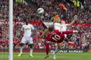 Manchester United's Wayne Rooney, bottom right, scores against Swansea City during their English Premier League soccer match at Old Trafford Stadium, Manchester, England, Saturday Aug. 16, 2014. (AP Photo/Jon Super)