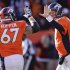 Denver Broncos quarterback Peyton Manning (18) gets a high five from Denver Broncos center Dan Koppen (67) after Manning threw a touchdown pass against the Cleveland Browns in the first quarter of an NFL football game, Sunday, Dec. 23, 2012, in Denver. (AP Photo/Joe Mahoney)