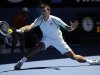Serbia's Novak Djokovic hits a forehand return to France's Paul-Henri Mathieu during their first round match at the Australian Open tennis championship in Melbourne, Australia, Monday, Jan. 14, 2013. (AP Photo/Andrew Brownbill)