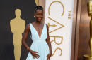 Lupita Nyong'o arrives at the Oscars on Sunday, March 2, 2014, at the Dolby Theatre in Los Angeles. (Photo by Jordan Strauss/Invision/AP)