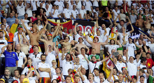 Germany fans cheer  during the Euro 2012 soccer championship Group B match between the Netherlands and Germany in Kharkiv, Ukraine, Wednesday, June 13, 2012. (AP Photo/Manu Fernandez)