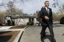 Actor George Clooney walks to talk with reporters outside the White House in Washington, Thursday, March 15, 2012, after a meeting with President Barack Obama. (AP Photo/Pablo Martinez Monsivais)