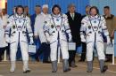 Members of the ISS crew U.S. astronaut Swanson and Russian cosmonauts Skvortsov and Artemyev walk prior to their launch at the Baikonur cosmodrome