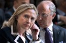 US Secretary of State Hillary Rodham Clinton and French Foreign Minister Laurent Fabius at the "Friends of Syria" conference in Paris, Friday, July 6, 2012. Syrian opposition leaders are pressing diplomats at an international conference for a no-fly zone over Syria, but the U.S. and its European and Arab partners are expected to focus on economic sanctions instead. (AP Photo/Brendan Smialowski, Pool)