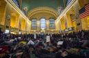 Protesters participate in a "Die-In" at Grand Central Station during a march for chokehold death victim Eric Garner in New York