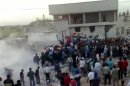Residents search for survivors after shelling by government forces in Hama