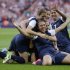 FILE - In this Thursday, Aug. 9, 2012 file photo, United States' Carli Lloyd, right, celebrates with teammates after scoring during the women's soccer gold medal match against Japan at the 2012 Summer Olympics, in London. (AP Photo/Ben Curtis, File)