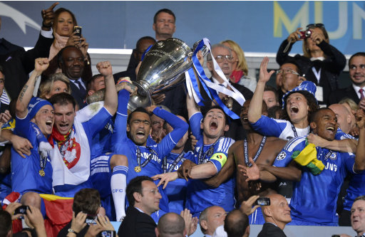 Chelsea's Jose Bosingwa holds up the trophy at the end of the Champions League final soccer match between Bayern Munich and Chelsea in Munich, Germany Saturday May 19, 2012. Didier Drogba scored the decisive penalty in the shootout as Chelsea beat Bayern Munich to win the Champions League final after a dramatic 1-1 draw on Saturday. (AP Photo/Martin Meissner)