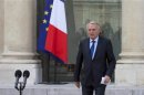 French Prime Minister Ayrault walks to deliver a speech after the weekly cabinet meeting at the Elysee Palace in Paris